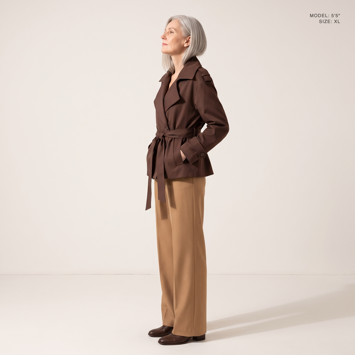 The Bexley Lapel Trench in Dark Brown, front view, model 5 foot 5 wearing size XL