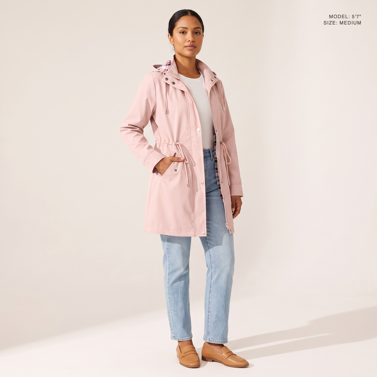 The Ashby Hooded Rain Trench in Pink, worn open to show the plaid flannel lining, model 5 foot 7 wearing size Medium