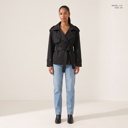 The Bexley Lapel Trench in Black, front view, model 5 foot 4 wearing size XS