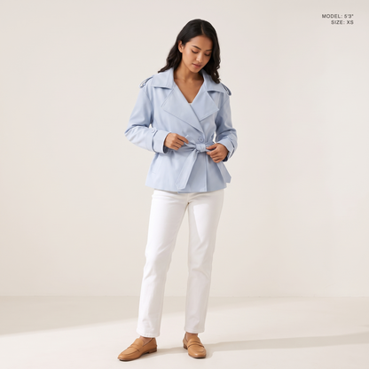 The Bexley Lapel Trench in Light Blue, front view, model 5 foot 3 wearing size XS