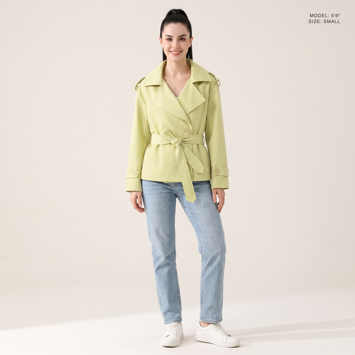 The Bexley Lapel Trench in Light Yellow Green, front view, model 5 foot 6 wearing size Small
