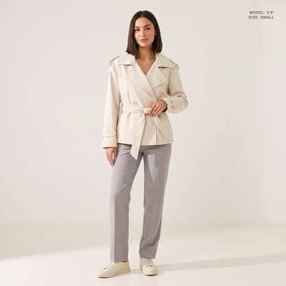 The Bexley Lapel Trench in Milky White, front view, model 5 foot 5 wearing size Small