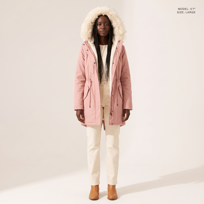 The Camden Sherpa Parka in Pink, hood up and worn open to show the sherpa fleece lining, model 5 foot 7 wearing size Large
