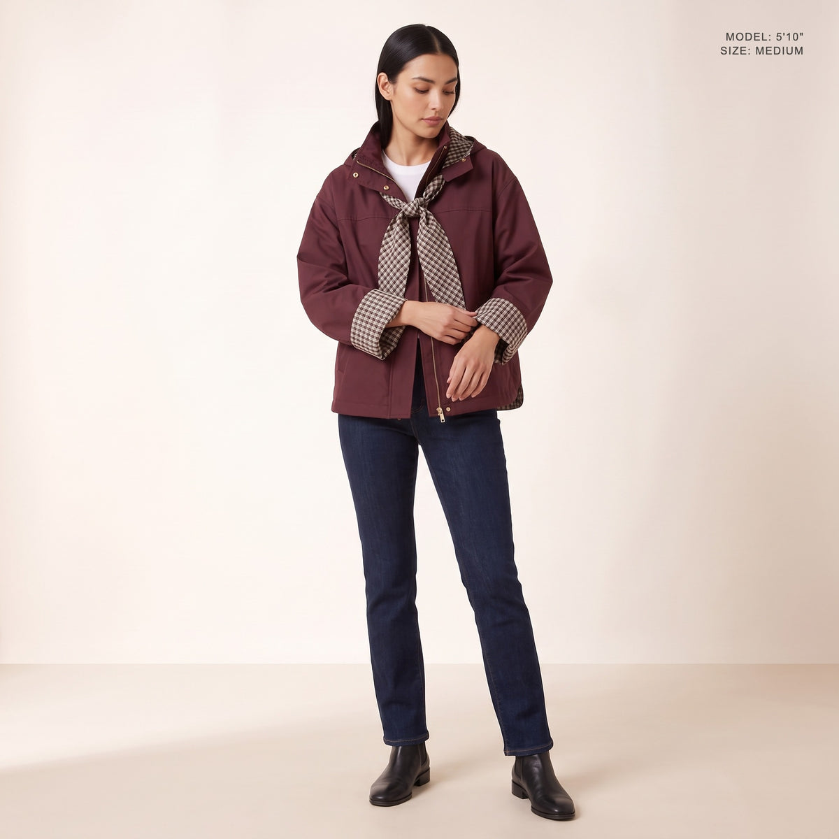 The Hartley Hooded Windbreaker in Oxblood showing the wide plaid cuffs, model 5 foot 10 wearing size Medium