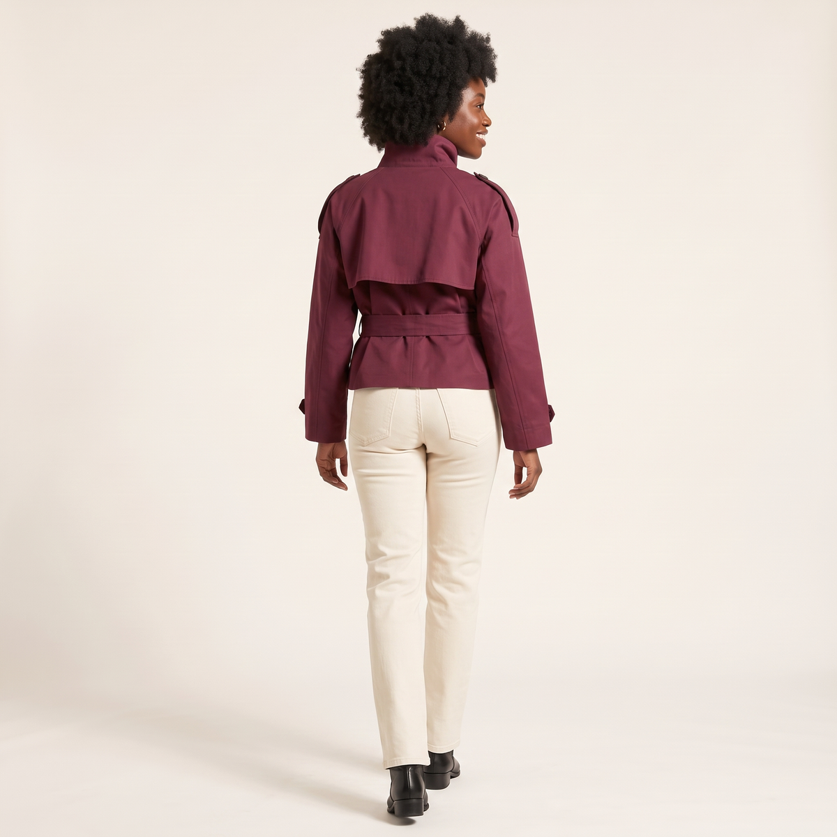 The Halston Cropped Trench in Burgundy, back view showing the cape storm flap and belted waist