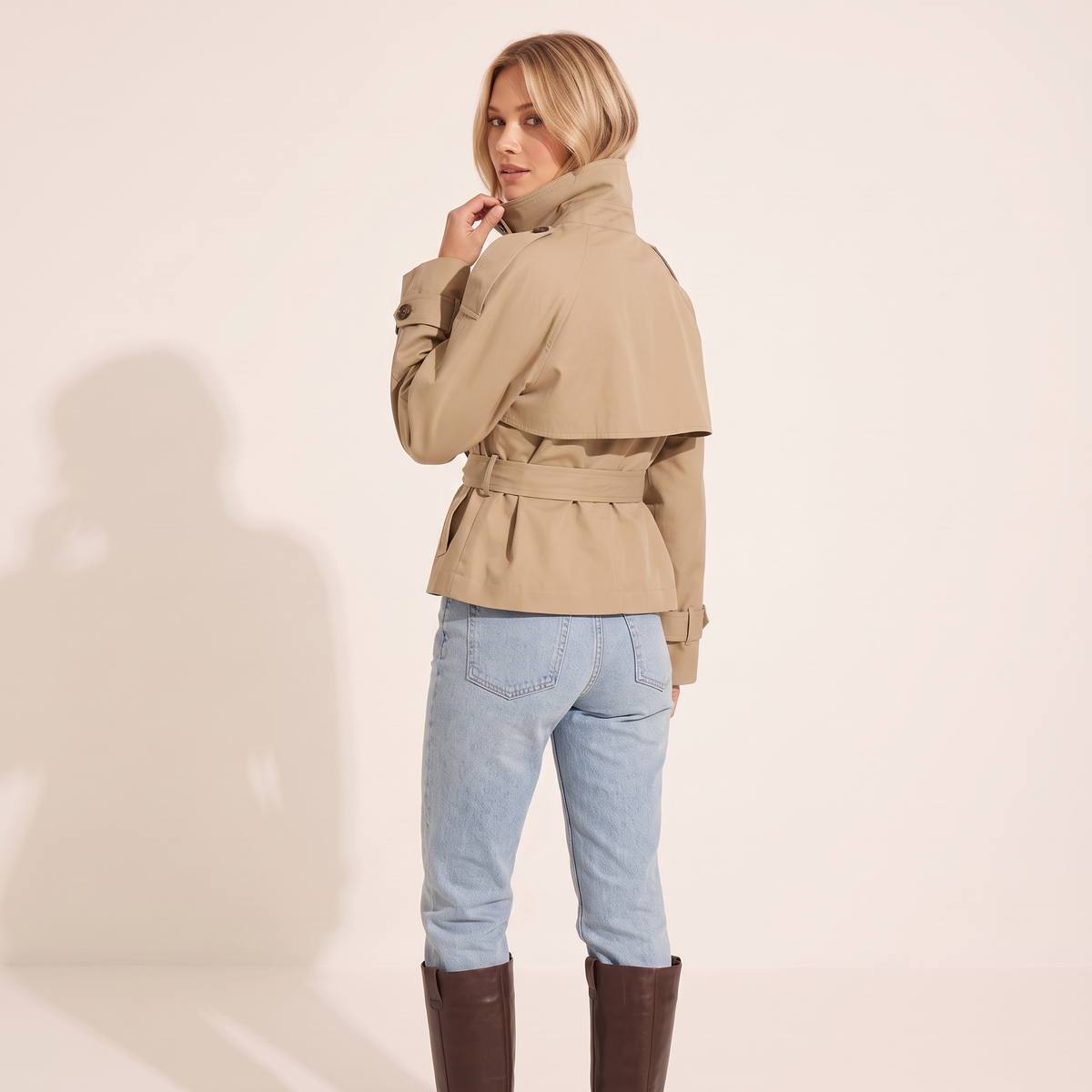 The Halston Cropped Trench in Khaki, back view showing the cape storm flap and belted waist