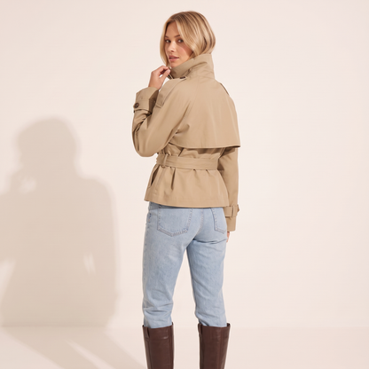 The Halston Cropped Trench in Khaki, back view showing the cape storm flap and belted waist