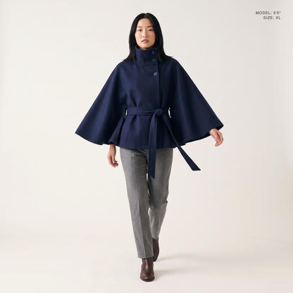 The Marlowe Cape Coat in Navy Blue, front view, model 5 foot 5 wearing size XL